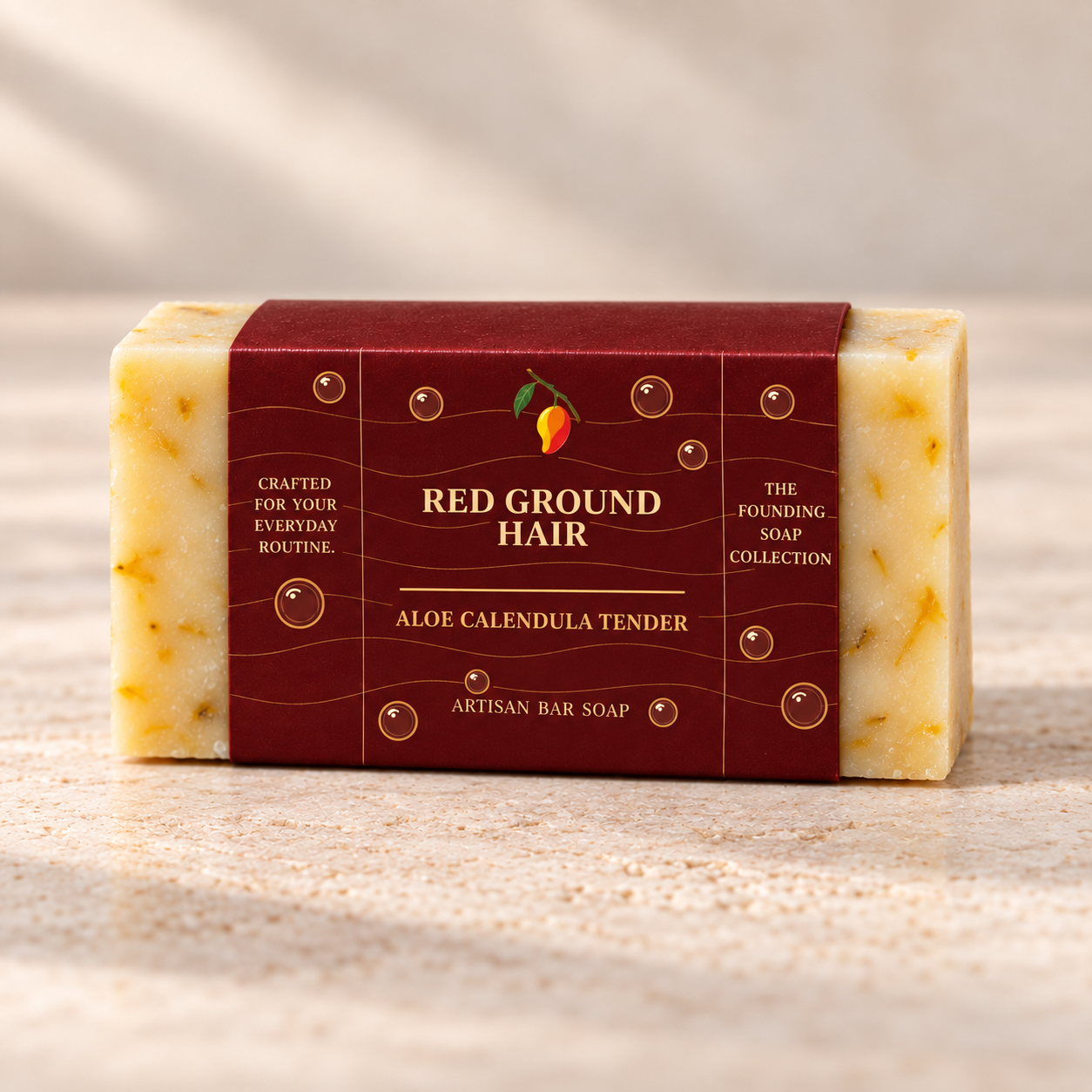 Aloe Calendula Tender artisan bar soap in its Imperial Maroon Red Ground Hair sleeve