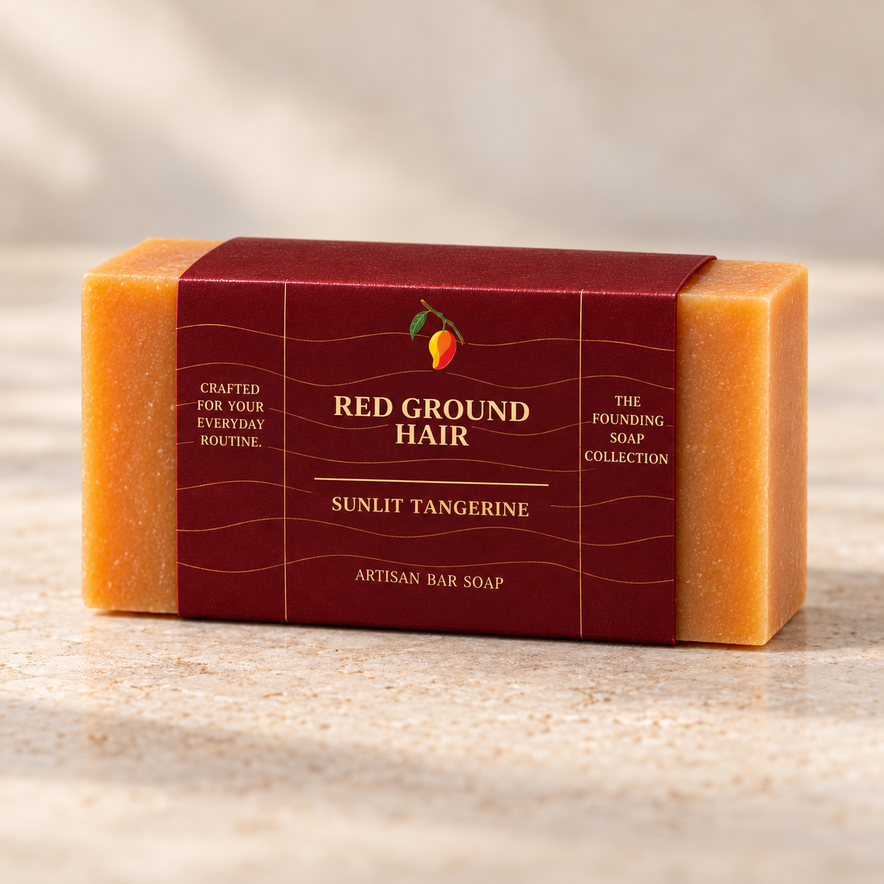 Sunlit Tangerine artisan bar soap in its Imperial Maroon Red Ground Hair sleeve